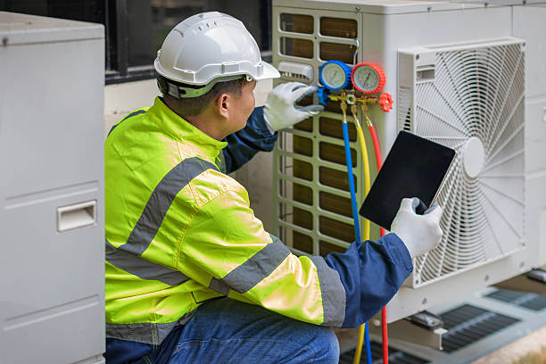 Professional Ductwork Repair technician working in Harrah, WA